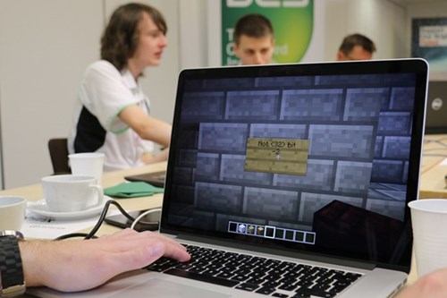 Laptop showing a virtual-room puzzle in the cyber security game.
